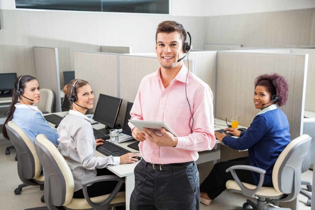 people in an office environment being happy to work